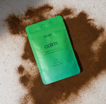 Load image into Gallery viewer, Adapt Reishi Packaging on a surface, with Reishi Powder beneath